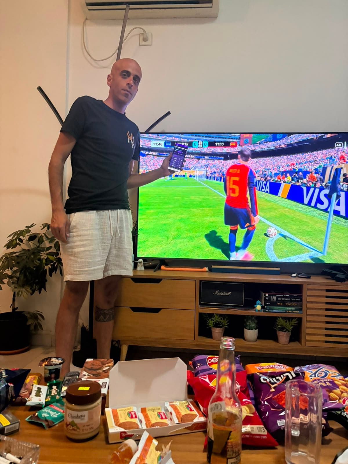 A Gaffer league member checking his team during the match