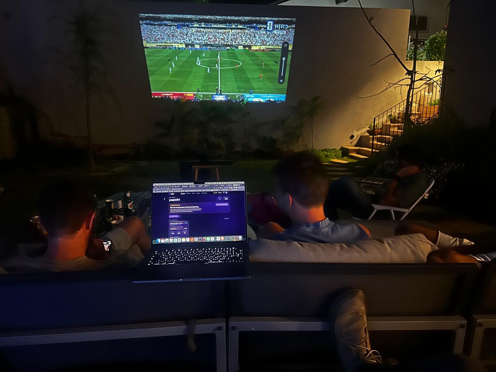 Friends using Gaffer during an outdoor football watch party